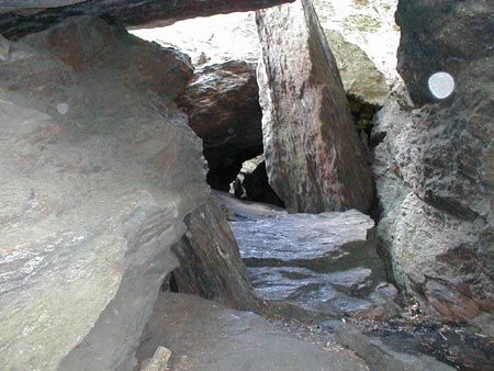 Leatherman cave with several orbs floating by.