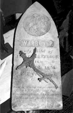 A headstone used as a satanic altar as seen in the Warren's Occult Museum.
